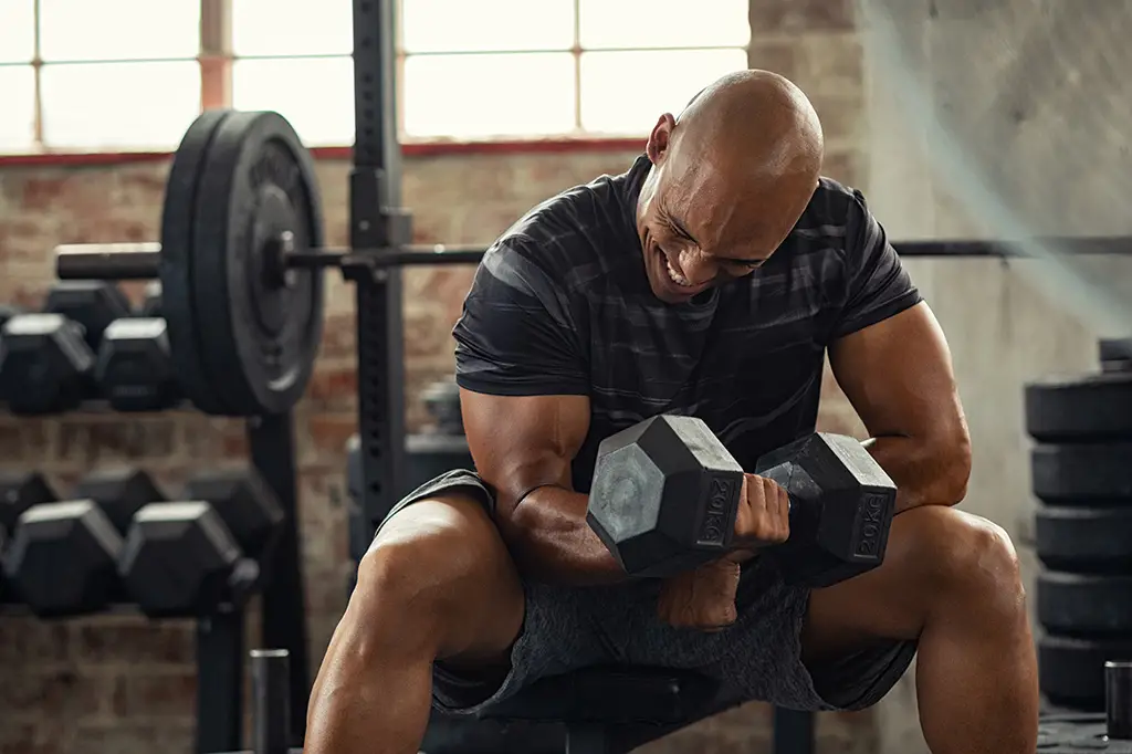 man-lifting-weights-bicep-curl